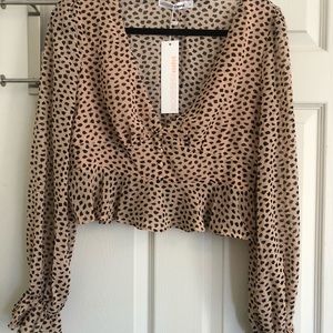 Cheetah like print blouse. NWT